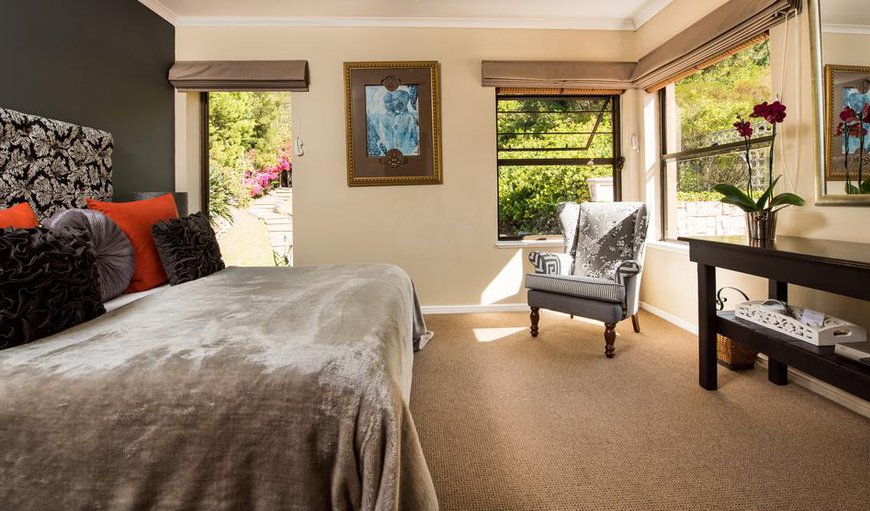 Mountain Facing Double Room - Each bedroom leads out to the mountain garden and contains a flat screen TV and an en-suite bathroom. Mountain Facing Double Room - Each bedroom leads out to the mountain garden and contains a flat screen TV and an en-suite bathroom.