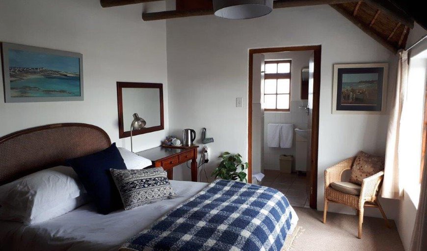 Upstairs Double Room BR2: BR2:Double bedroom en-suite with shower and bath; Queen size bed; View of the Arniston Dunes, a partial view of the sea and the fishing village of  Kassiesbaai (a national monument); Built in safe; hairdryer; TV - 19 Channel DSTV  view or bring own decoder & smart card. (no signal for PVR decoders)