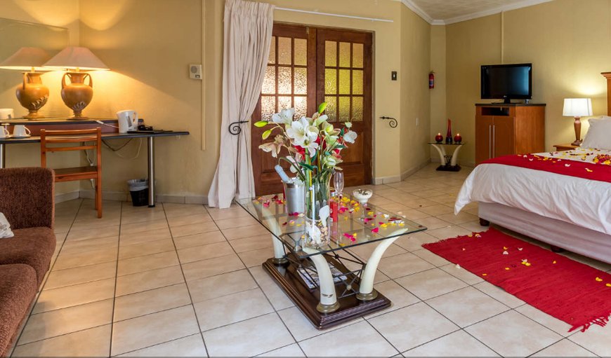 Ultra Luxury (1): Ultra Luxury Room: There is a lounging area with colour TV and DSTV, air-conditioning and heating for when needed and a dream bathroom with a large spa bath, double shower and dressing area.