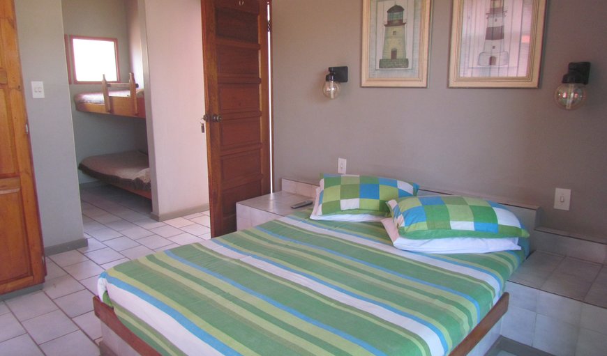 No26 Standard Room: Upstairs Family: Standard Room 26: Family Room. 
This room is upstairs and consists of a double bed, bunk bed and bath with a ceiling fan, TV and kettle, The room also has a small balcony 