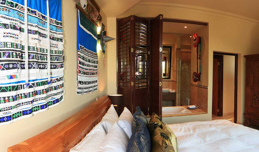 The Executive Suite: An extra-large suite with a super king size bed decorated with original African artwork. The Executive Suite: An extra-large suite with a super king size bed decorated with original African artwork.