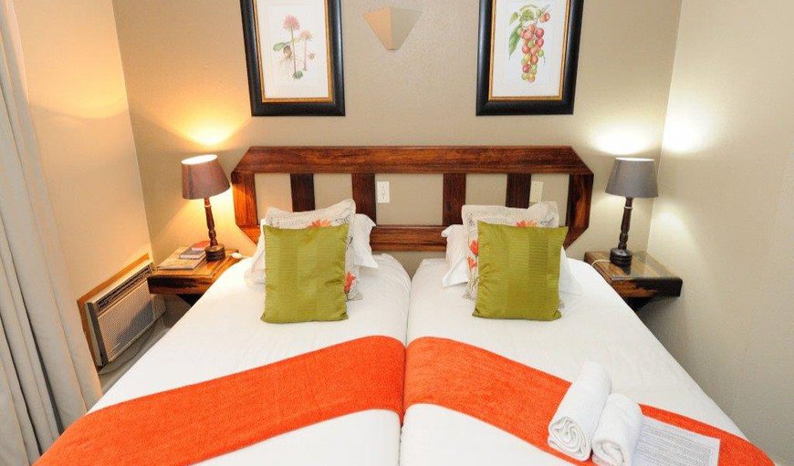 Twin Rooms: . 2x ¾ beds, Mini fridge, flat screen television with hotel bouquet channels, air-conditioned with en-suite bathroom with shower. Coffee and tea station with room amenities