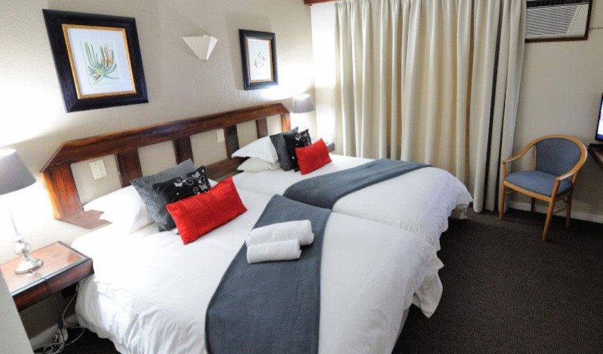 2x ¾ beds, Mini fridge, flat screen television with hotel bouquet channels, air-conditioned with en-suite bathroom with shower. Coffee and tea station with room amenities 2x ¾ beds, Mini fridge, flat screen television with hotel bouquet channels, air-conditioned with en-suite bathroom with shower. Coffee and tea station with room amenities