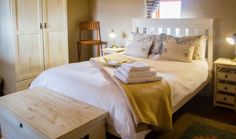 One-bedroom chalet: The main bedroom has a double bed with crisp percale linen and en-suite bathroom.