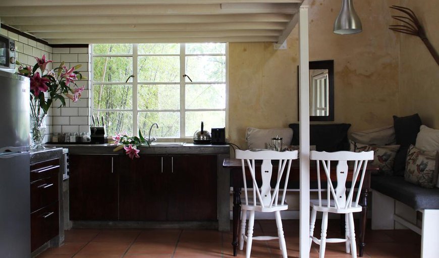 Anneline Cottage- The ground floor has a tastefully decorated lounge with free standing fireplace with 2 single sleeper couches (that can convert to a queen bed) with bedding, fully equipped kitchenette, dining area, downstairs toilet and shower. Anneline Cottage- The ground floor has a tastefully decorated lounge with free standing fireplace with 2 single sleeper couches (that can convert to a queen bed) with bedding, fully equipped kitchenette, dining area, downstairs toilet and shower.