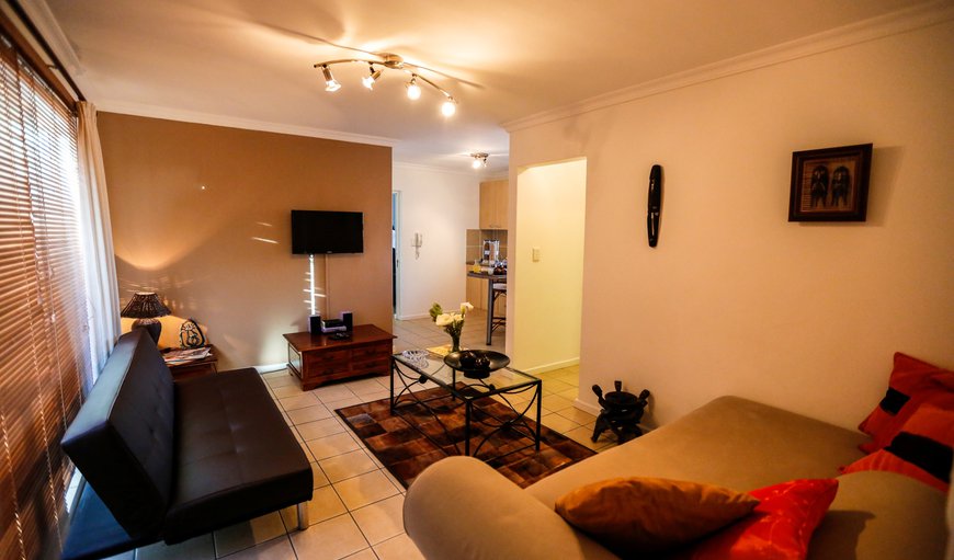 The lounge/living area inside the apartment is decorated with afro-chic contempory pieces, carefully chosen to compliment the serenity of Secret Garden. The lounge/living area inside the apartment is decorated with afro-chic contempory pieces, carefully chosen to compliment the serenity of Secret Garden.