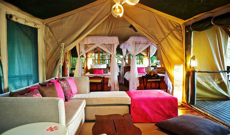 Luxury Tented Camp - The spacious tents offer 4-poster beds that are either a queen size bed or two twin beds and an en-suite bathroom. Luxury Tented Camp - The spacious tents offer 4-poster beds that are either a queen size bed or two twin beds and an en-suite bathroom.