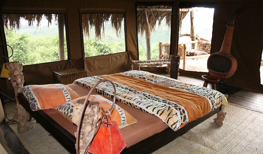 Tented Rooms: Crater Forest Tented Camp suite is fitted with a cozy fire place