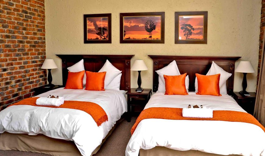 Luxury En-Suite Room: Luxury En-Suite Room furnished with two double beds.