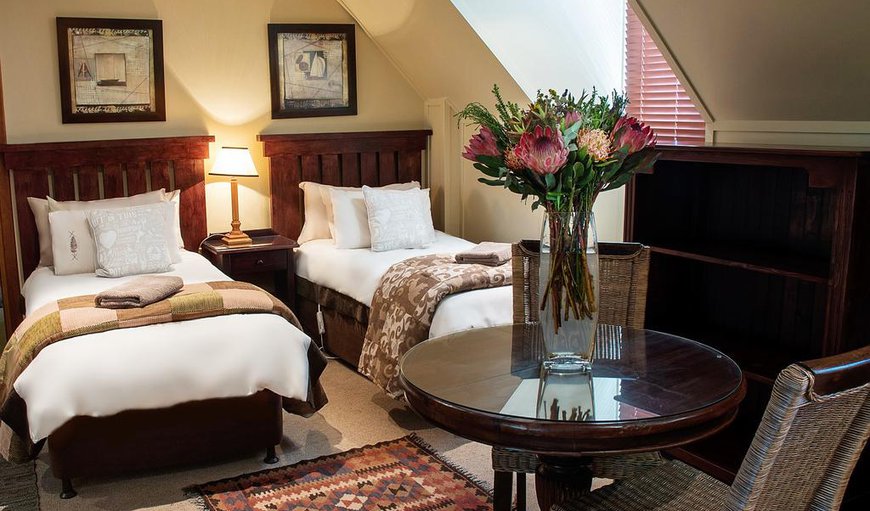 The large family room is furnished with a king size bed, two single beds, a table with chairs and a bathroom. The large family room is furnished with a king size bed, two single beds, a table with chairs and a bathroom.
