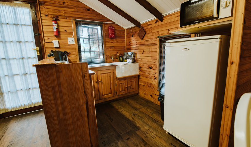 Family Room Tsitsikamma Self Catering - The kitchenette is equipped with a fridge, microwave and a kettle. Family Room Tsitsikamma Self Catering - The kitchenette is equipped with a fridge, microwave and a kettle.