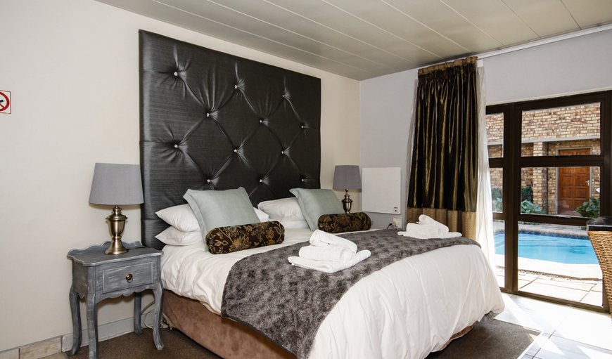 This room has a lovely view over the swimming pool. With it's King sized bed, it will ensure you have a comfortable night's rest. It also has an en-suite bathroom, with a shower and bath. Amenities include tea and coffee facilities, a heater, a bar fridge, flat screen TV, DSTV, towels and linen. This room has a lovely view over the swimming pool. With it's King sized bed, it will ensure you have a comfortable night's rest. It also has an en-suite bathroom, with a shower and bath. Amenities include tea and coffee facilities, a heater, a bar fridge, flat screen TV, DSTV, towels and linen.