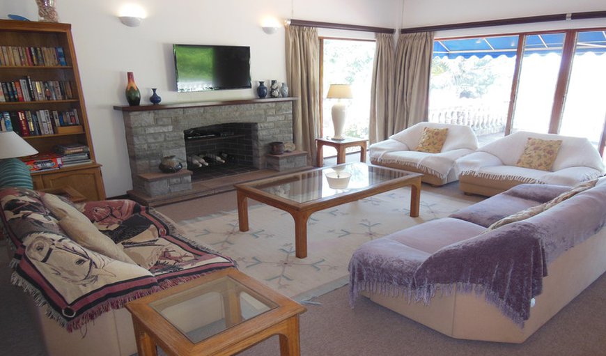 115 NKWAZI DRIVE, Zinkwazi beach: The lounge is perfect for relaxing and lounging with a warm cup of tea and a chapter or two in your favorite book, Enjoy the lounge fire place to keep you warm and toasty on those colder nights of the year