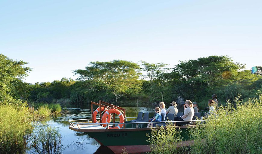 Join us on a relaxing boat cruise on the Mzinene River that runs through our reserve. This unique cruise can be enjoyed as a morning cruise or as a sunset cruise while watching breath taking bird life with a good chance of seeing Hippo and Crocodile. Join us on a relaxing boat cruise on the Mzinene River that runs through our reserve. This unique cruise can be enjoyed as a morning cruise or as a sunset cruise while watching breath taking bird life with a good chance of seeing Hippo and Crocodile.