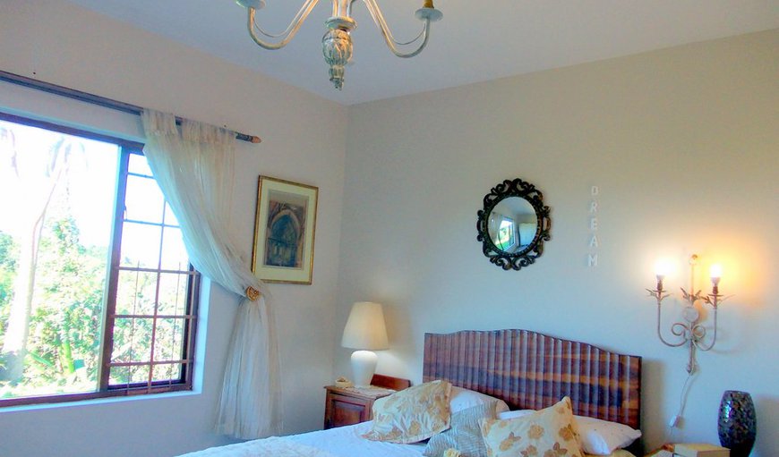 Sea Valley Villa - Self Catering: GOLDEN SUNSET - lovely large bedroom has sea view. wardrope dressing table laptop table with overhead antique gold chandelier and wall mounted lights.