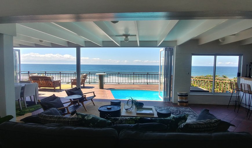 The beautifully decorated living space has large stacking doors which extends this space onto a beautiful deck with pool The beautifully decorated living space has large stacking doors which extends this space onto a beautiful deck with pool