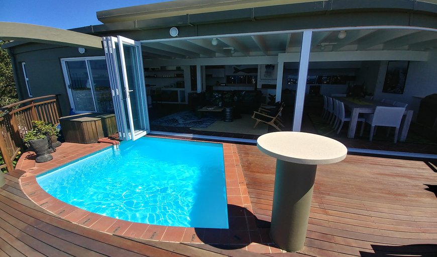 The beautifully decorated living space has large stacking doors which extends this space onto a beautiful deck with pool. The beautifully decorated living space has large stacking doors which extends this space onto a beautiful deck with pool.