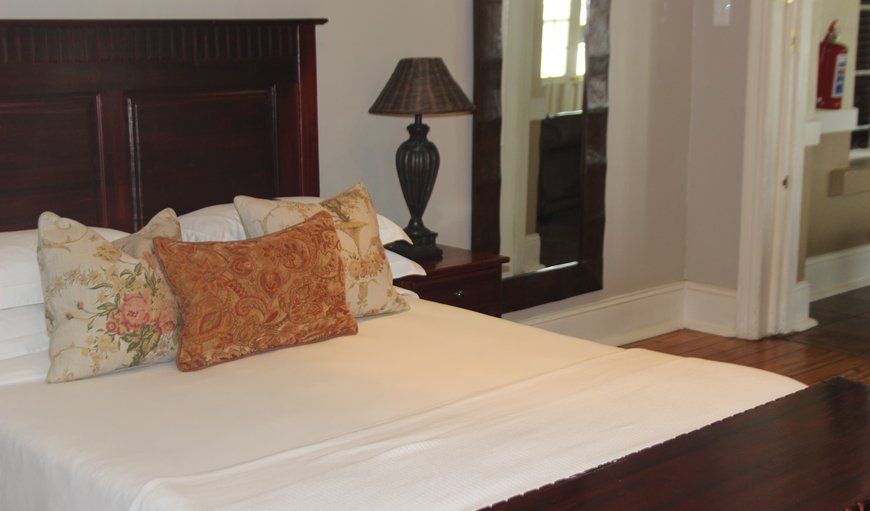 Queen Room: Queen size bed with on-suite bathroom with shower