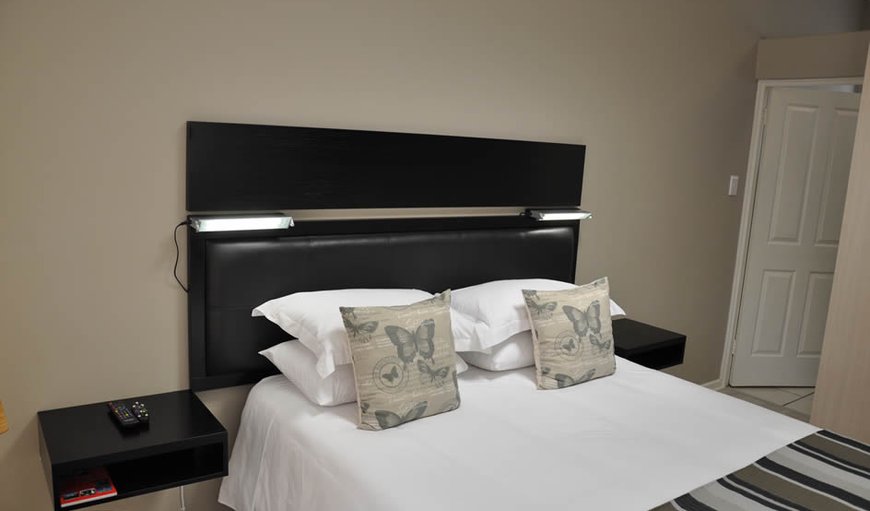 Luxury Corporate Room 4: Luxury Corporate Room 4 and 5 - These rooms offer a queen size bed, an 82cm LED TV with DSTV, a bar fridge with coffee/tea facilities and an en-suite bathroom with a shower.