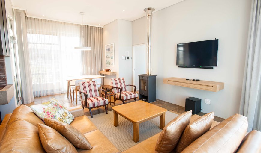 High Tide - Unit: High Tide - The lounge area is furnished with a beautiful corner couch and offers a TV and spectacular views.