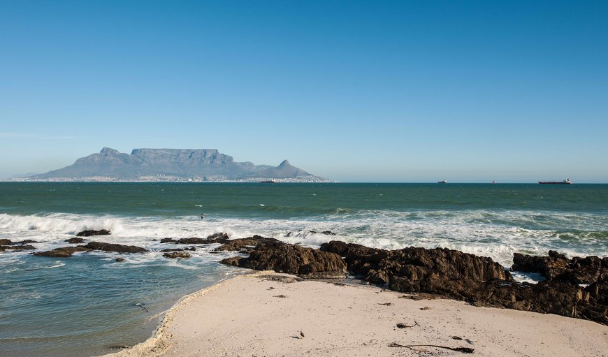 The house is situated right on the beach and has spectacular views of Table Mountain, the Atlantic Ocean and Robben Island. The house is situated right on the beach and has spectacular views of Table Mountain, the Atlantic Ocean and Robben Island.