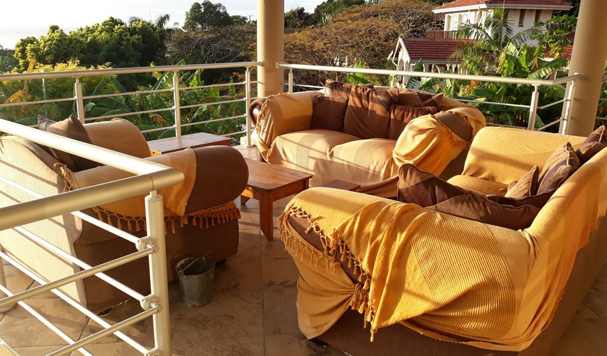 The patio upstairs overlooking the sea and garden