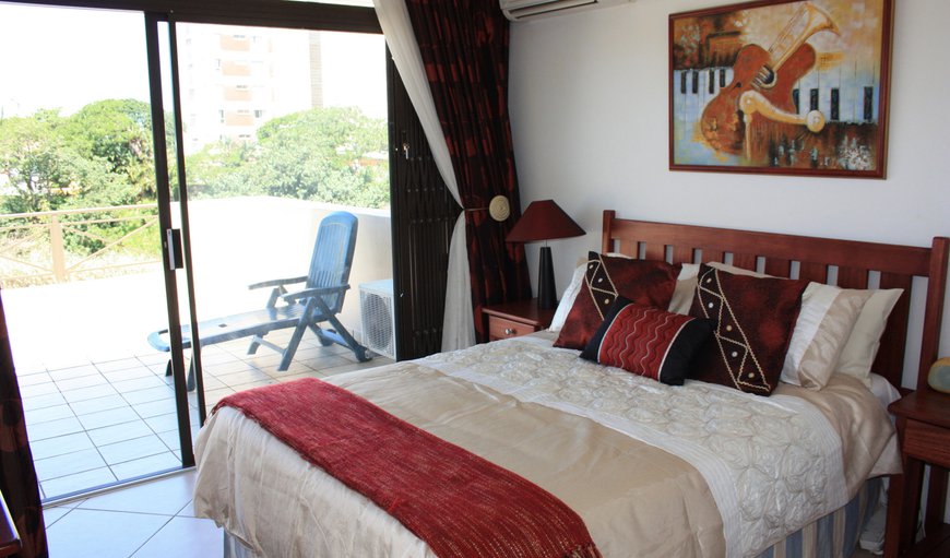 Unit 15 (3 bedroom, 6 sleeper self catering apartment): The main bedroom has sliding doors leading out onto the balcony.