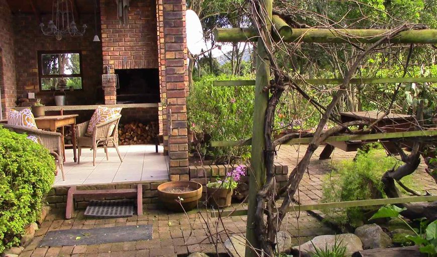 Forests Nest Cottage features a covered braai area with garden views.
