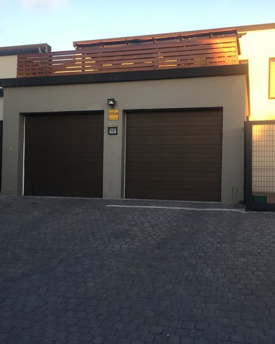 main home showing apartment on right side with secure parking 