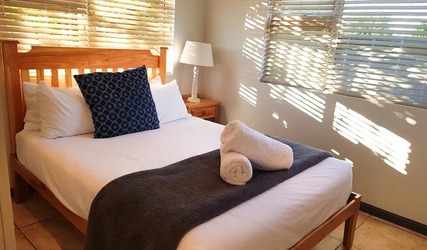 Pearly Sands: The main bedroom is furnished with a double bed and has an en-suite bathroom.