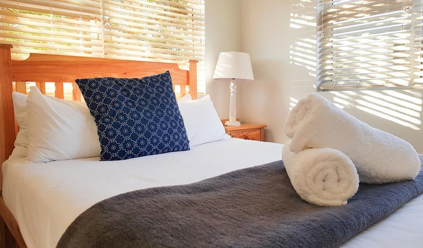 Pearly Sands: The main bedroom is furnished with a double bed and has an en-suite bathroom.