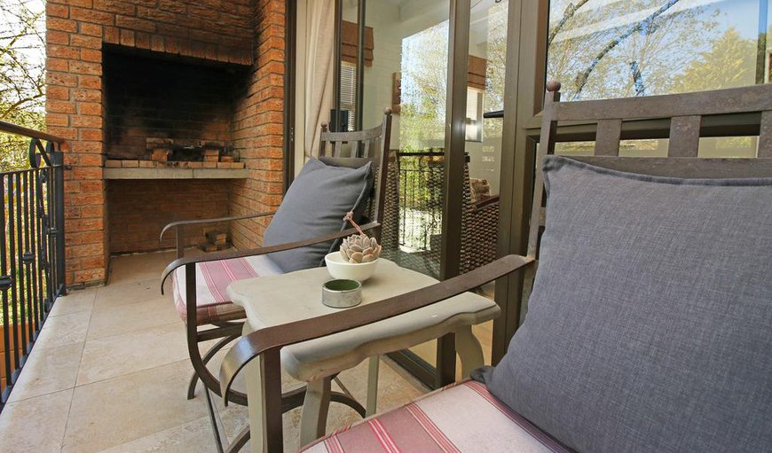 One bedroom apartment with balcony - This apartment features a living room with sliding doors leading out onto a small balcony with a built-in braai. One bedroom apartment with balcony - This apartment features a living room with sliding doors leading out onto a small balcony with a built-in braai.