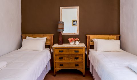 BOTTERBOOM: This room is equipped with two single beds, an en-suite bathroom (shower only), a coffee station and fan.  For your sleeping comfort we provide pure cotton percale bedding and towels.  This room has been equipped for the wheelchair-bound holidaymaker.