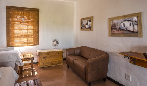 Chardonnay: This room is equipped with two single beds, an en-suite bathroom (shower only), a coffee station and fan.  For your sleeping comfort we provide pure cotton percale bedding and towels.  This room has been equipped for the wheelchair-bound holidaymaker.