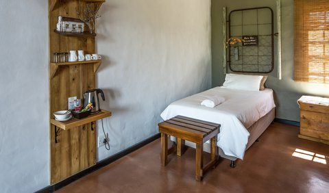 Pinotage: This room is equipped with two single beds, an en-suite bathroom (shower only), a coffee station, fan and electric blanket.  For your sleeping comfort we provide pure cotton percale bedding and towels.  This room has been equipped for the wheelchair-bound holidaymaker.