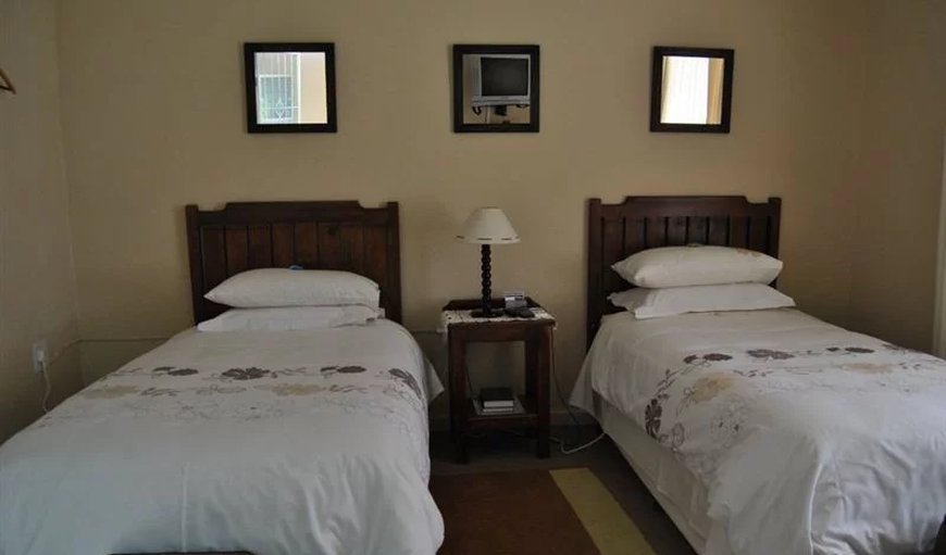 Room 1: Room 1 - This bedroom is furnished with 2 single beds