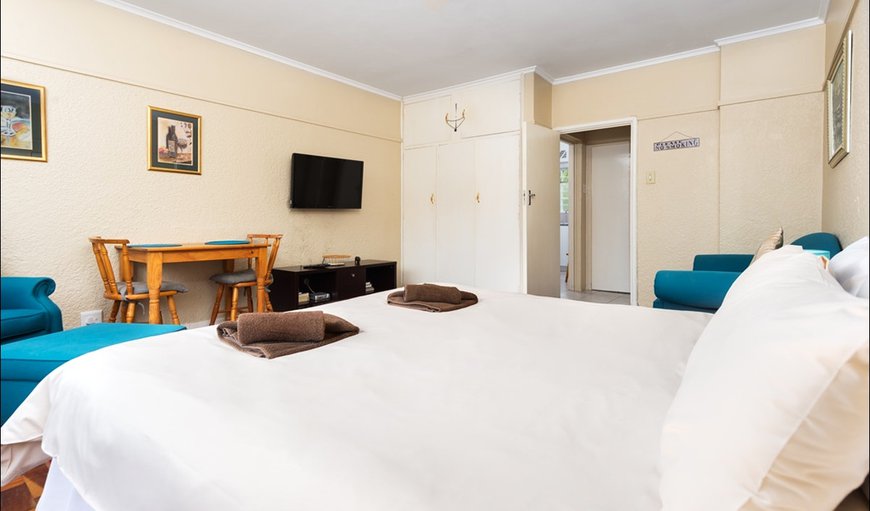 The bedroom is furnished with two single beds or a king size bed and a TV with selected DSTV channels. The bedroom is furnished with two single beds or a king size bed and a TV with selected DSTV channels.
