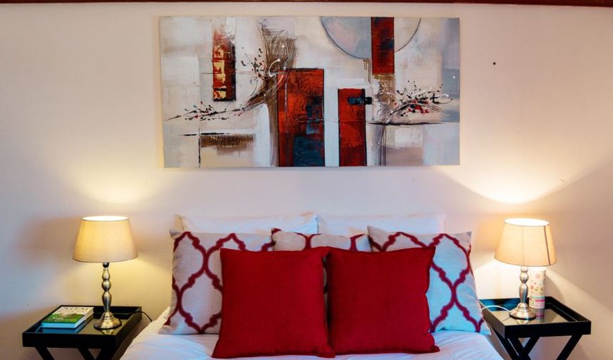Red Room: Red Room - The room offers a double bed and a TV with selected DSTV channels and has a separate private bathroom with a shower.