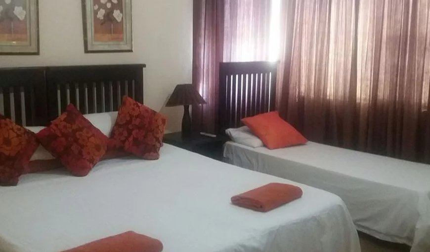 En-suite room with king size bed and single bed.