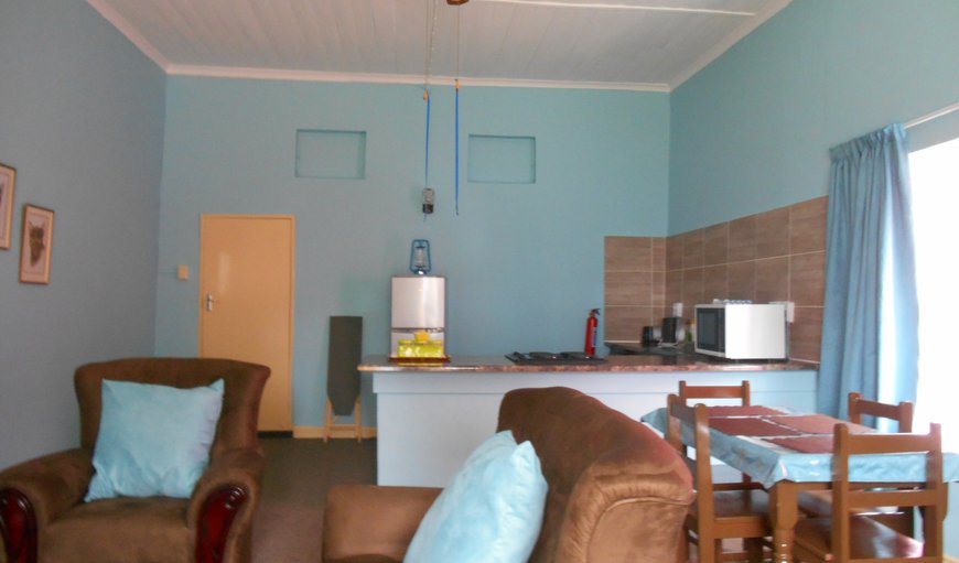 Self-catering Family Units - One Bedroom: English Country one bedroom cottage lounge and kitchenette.