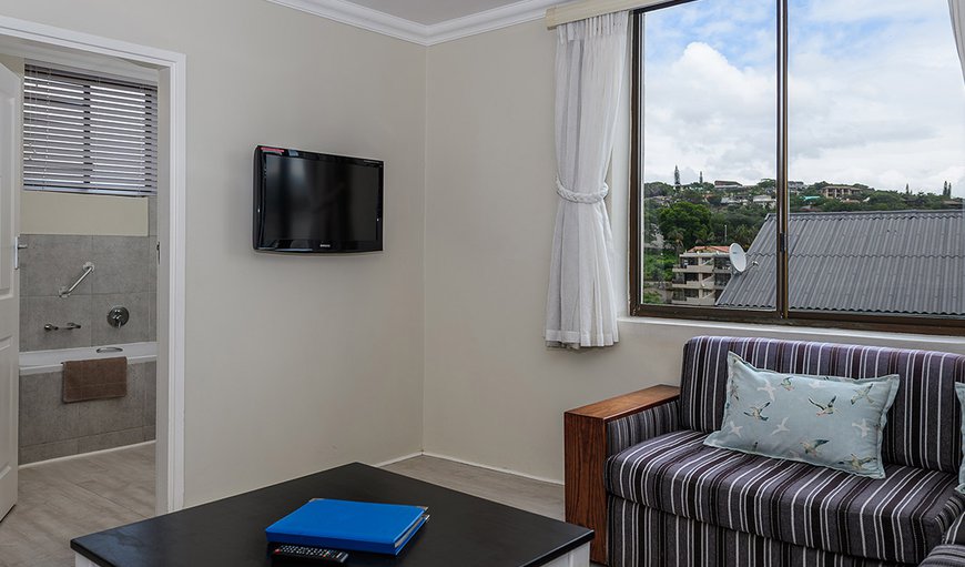 One Bedroom Apartment: There is a TV lounge as well where you can get comfy on these soft couches and watch some old time classics or new releases with family and friends