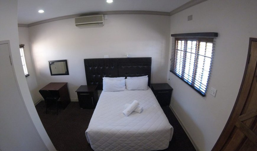 Room 2: Room 2 contains a double bed and en-suite bathroom with a shower, and a TV with M-Net and selected DSTV channels.