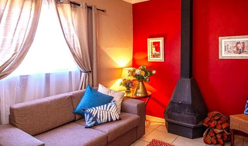 Isabella Unit: Isabella Unit - The living room is furnished with a sleeper couch and a fireplace