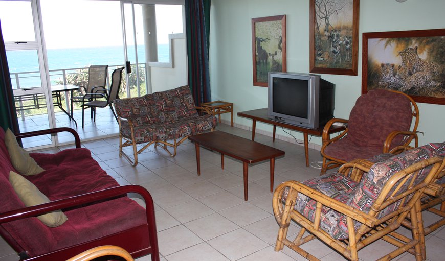 The lounge area is tastefully furnished with comfortable couches and a TV with DSTV (Family Bouquet) and a DVD player.