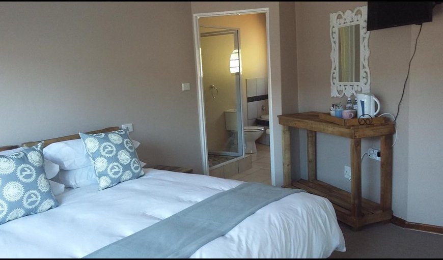 Double bed with private bathroom: Neat room with a double bed and private bathroom.

