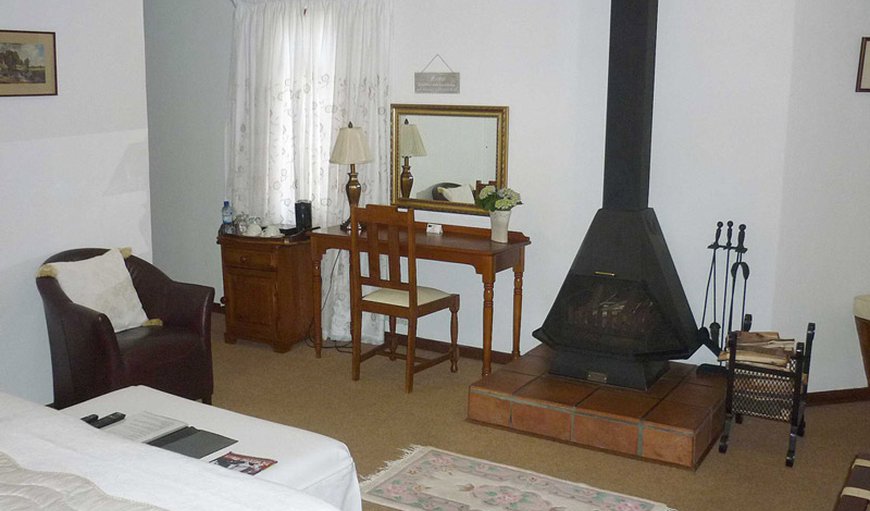 Luxury King Size Bed room : Luxury Suite bedroom with fireplace and vanity table.