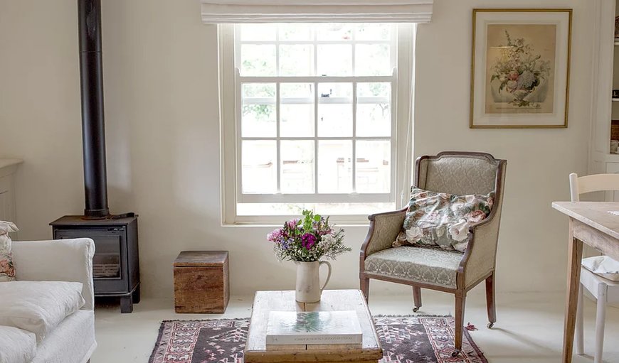 Lady Chatterleys Chamber: The gardner's cottage lounge area with fireplace.