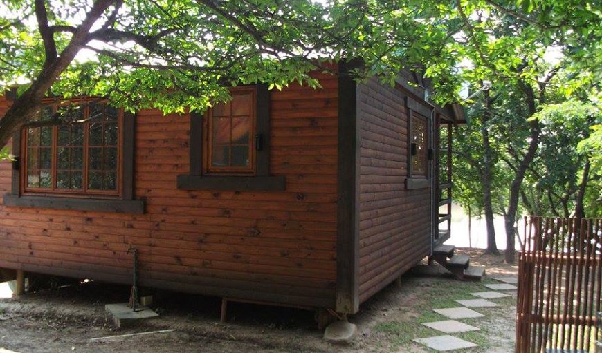 Log Cabins: Log Cabin - situated on an island overlooking the dam.