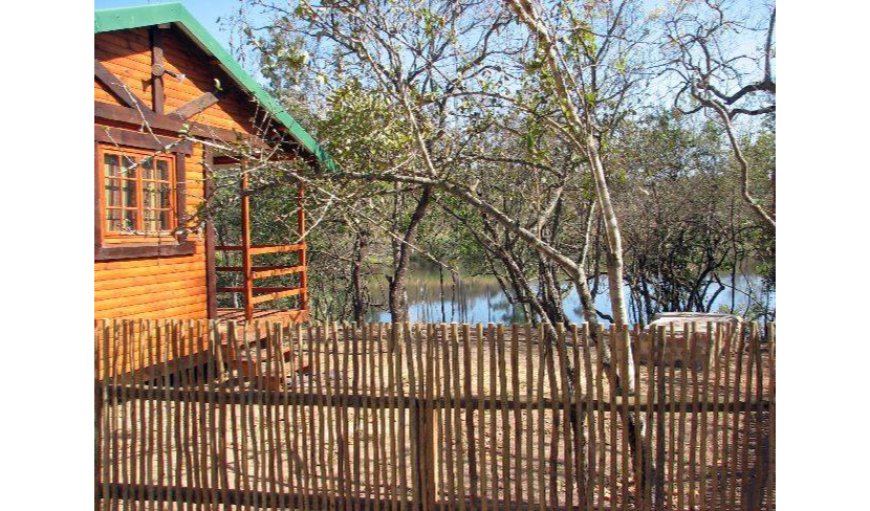 Log Cabins: Log Cabin - situated on an island overlooking the dam.