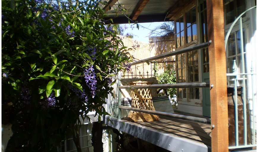 A small deck wraps itself around the old kitchen made from recycled I beams and stainless steel pipes. A small deck wraps itself around the old kitchen made from recycled I beams and stainless steel pipes.